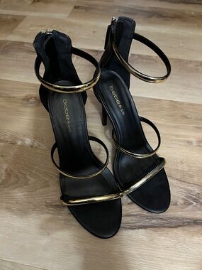 bebe Black and Gold Multi-Strap Stiletto Sandals